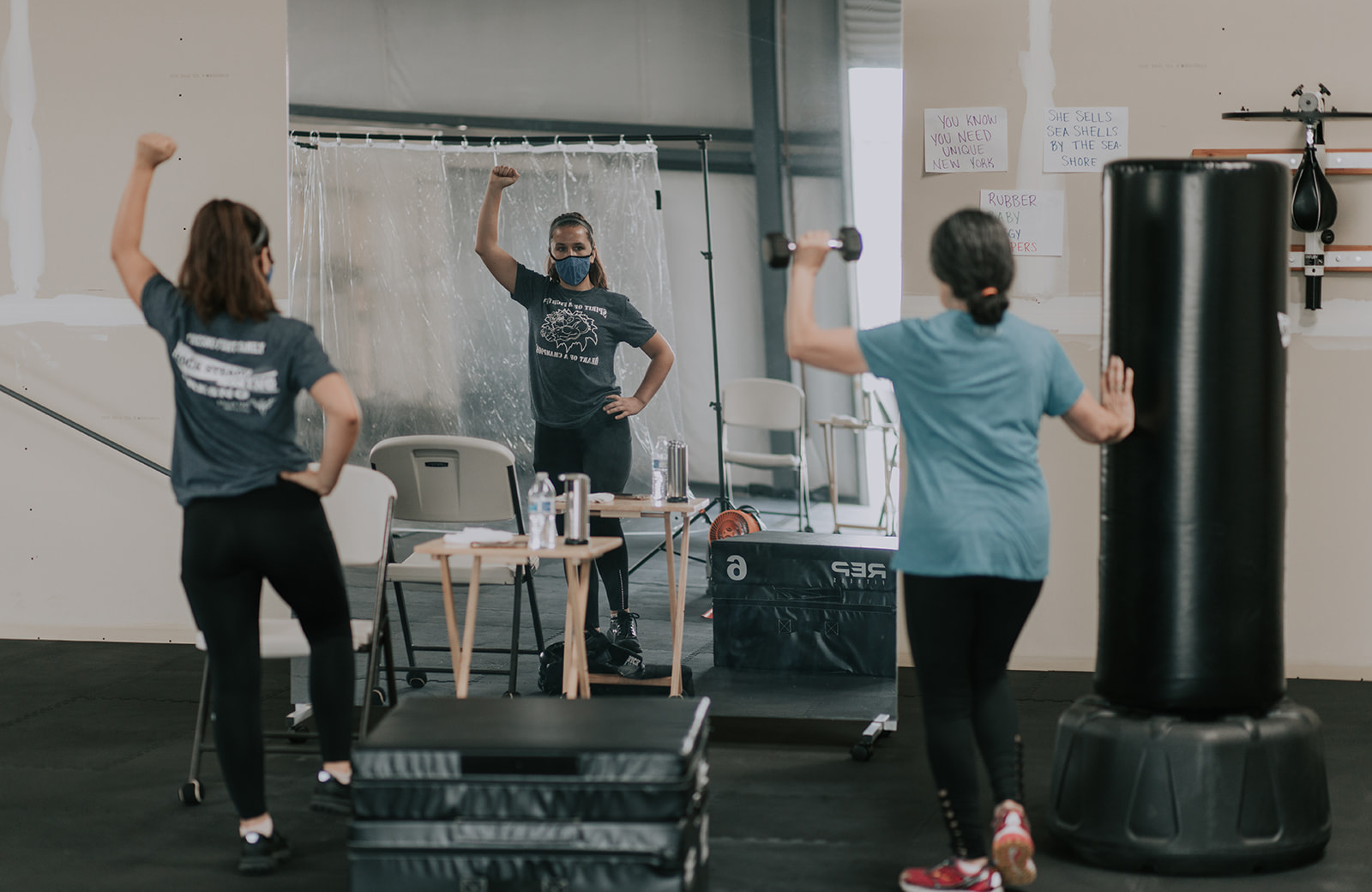 A personal trainer working with a client at their home