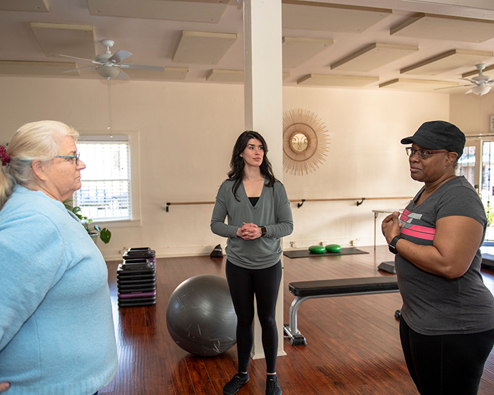 A fitness instructor creating a community of compassion and mutual support for cancer survivors